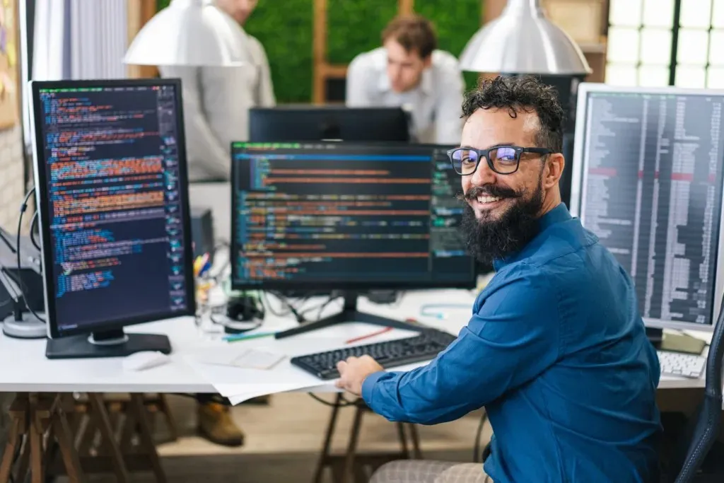 computer-programmer-working-at-his-desk