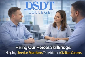 Three people in business attire converse at a conference table, smiling. Text above reads "DSDT College," below: "Hiring Our Heroes SkillBridge program."